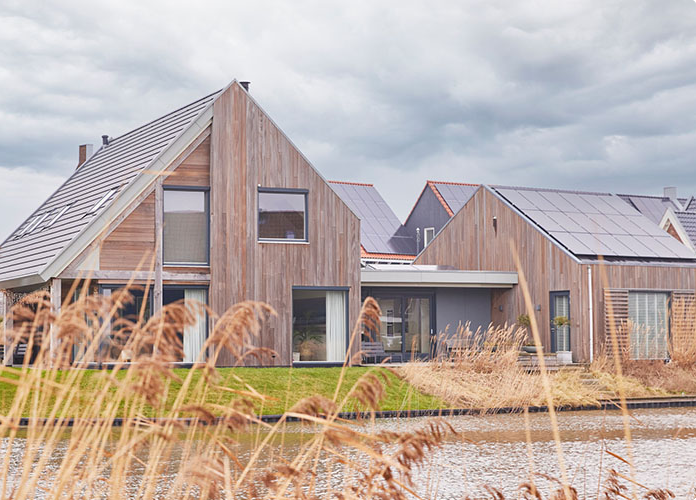 Woningen met houten gevelbekleding uit eigen productie